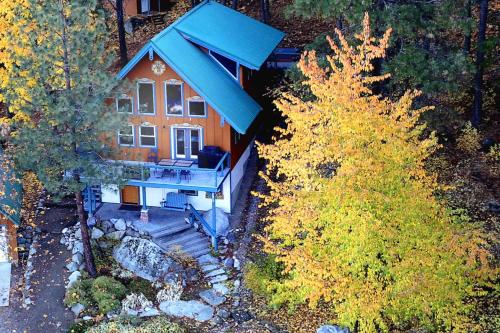 an aerial view of a house with a blue roof at Tamarack Haus Hot Tub and EV Charging Walk Dtwn! in Leavenworth