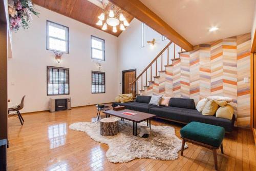 a living room with a couch and a table at THE BLAUBAUM TOYA in Lake Toya