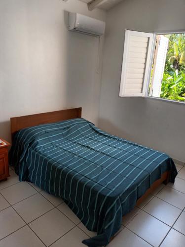 Postel nebo postele na pokoji v ubytování Residence Corail