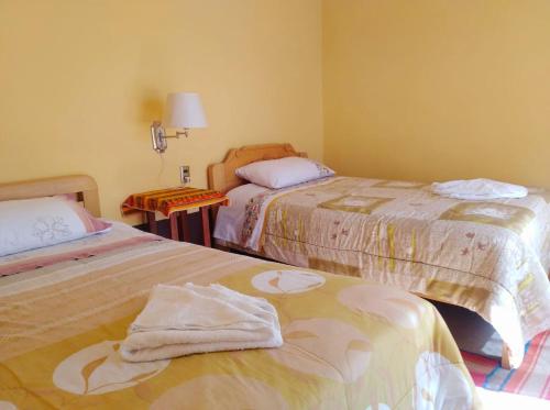 Ein Bett oder Betten in einem Zimmer der Unterkunft Wara Uta Lodge