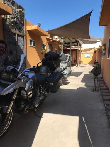 a motorcycle parked on the side of a building at Casa Edka in Ensenada