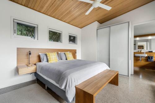 a bedroom with a bed and a ceiling fan at Aalborg Bright in Bright