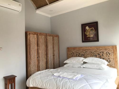 מיטה או מיטות בחדר ב-Most Bali Malioboro Villa