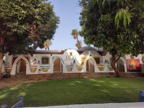 a house with a painting on the side of it at Maghrabi's Guest house in Aswan