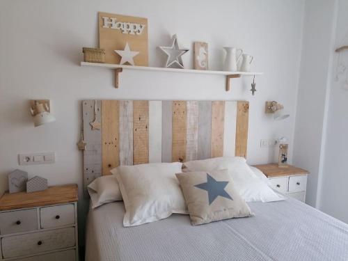 Postel nebo postele na pokoji v ubytování Apartamento rusticchic con terraza