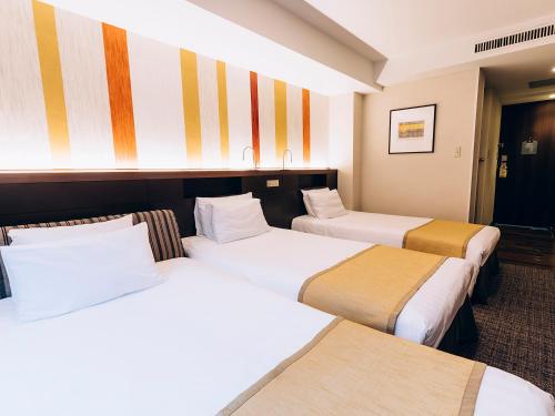 Postel nebo postele na pokoji v ubytování Shinagawa Tobu Hotel