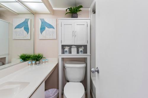 a bathroom with a toilet and a sink at Hosteeva 1BR Oceanfront Condo in Atlantica Resort near Boardwalk in Myrtle Beach