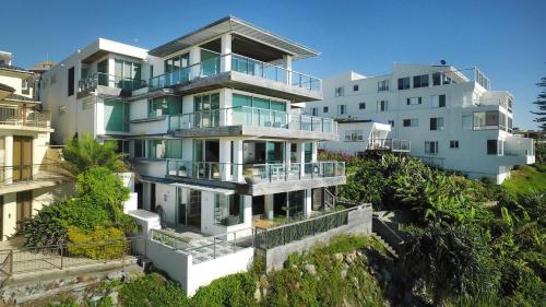 a large white building with balconies on top of it at ON THE Rocks - Yamba's Ultimate Absolute Beachdirft Residence - Holiday Yamba in Yamba