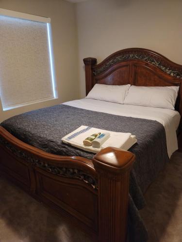 a bed with a wooden frame with a tray on it at Jule Sleep in Denver