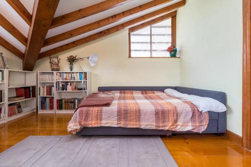 a bedroom with a bed and a book shelf at Exclusivo Chalet en Potes in Potes