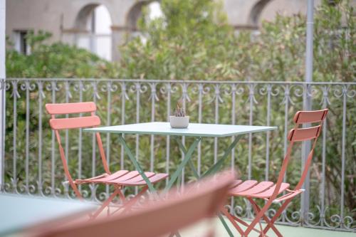 a table and two chairs on a balcony at Il Giardino Nascosto B&B in Vasto