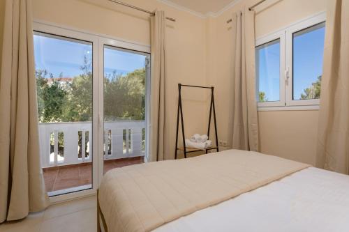 A bed or beds in a room at Villa Melody Complex