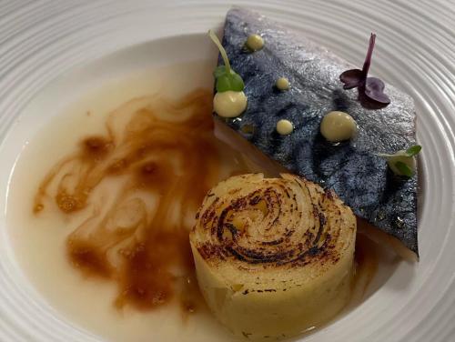 a plate of food with a dessert on it at Locanda Garzelli in Quercianella