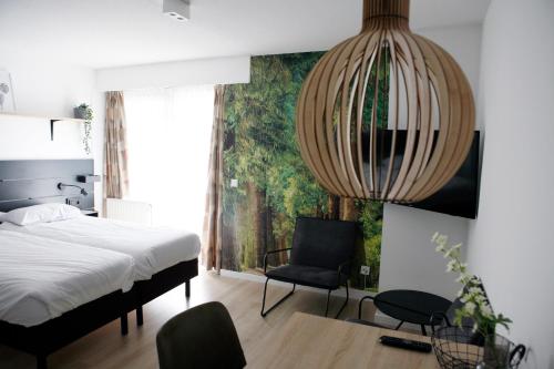 Postel nebo postele na pokoji v ubytování Hotel & Appartementen - De Zeven Heuvelen