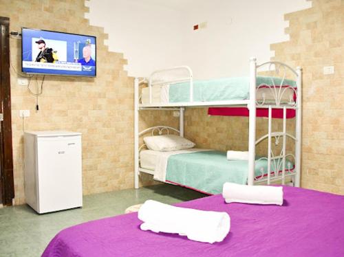 Postel nebo postele na pokoji v ubytování Vitrage Guest House