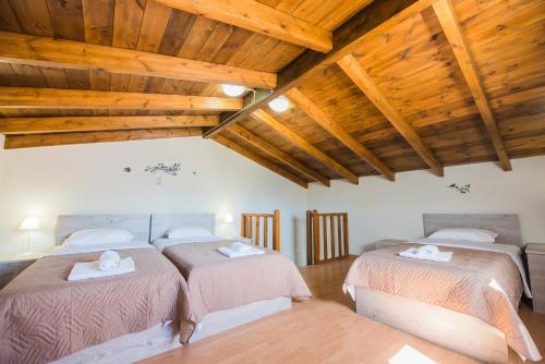 Кровать или кровати в номере Villa Ariadni - Cretan Hospitality
