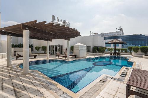 a large swimming pool on top of a building at HiGuests - Large Apt in the Heart of Deira Near Clocktower in Dubai