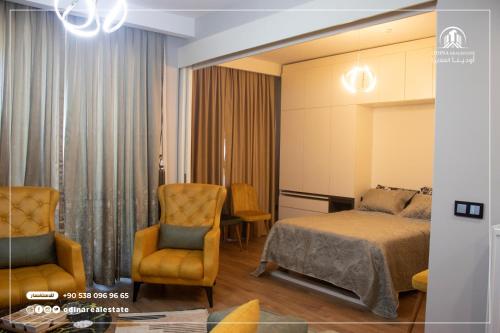 a hotel room with a bed and a chair at luxury holiday in the heart of istanbul in Istanbul