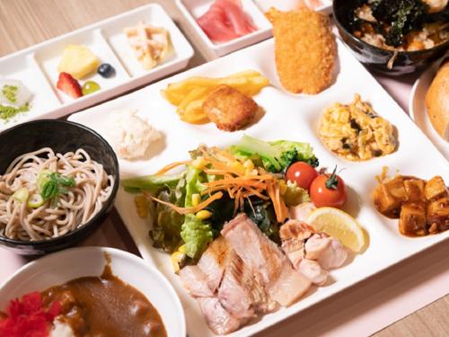 a plate of food with different types of food at LiVEMAX RESORT Miyahama Ocean View in Hatsukaichi