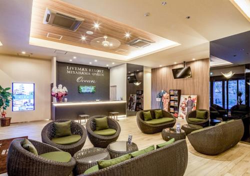 a lobby with couches and chairs in a store at LiVEMAX RESORT Miyahama Ocean View in Hatsukaichi
