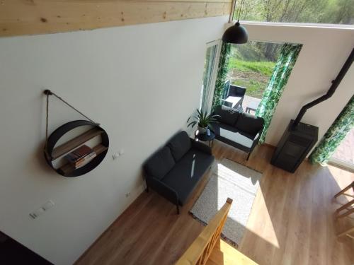an overhead view of a living room with a couch at Stodoły Hołosanka 600-065-145 in Polańczyk