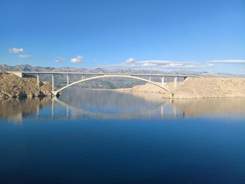 a bridge over a large body of water at Apartmani Branka in Rtina
