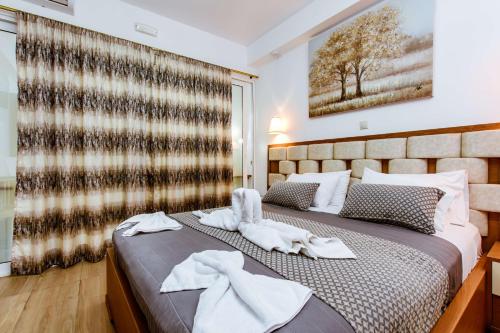 Bozzali Deluxe Hotelにあるベッド