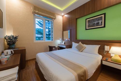 Giường trong phòng chung tại Duy Vinh Hotel Dalat