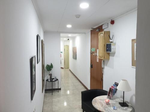 TV a/nebo společenská místnost v ubytování Hostal Absolut Stay