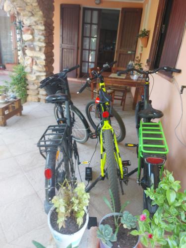 two bikes parked next to each other on a porch at Paraiso Sardo 1 in Villasimius