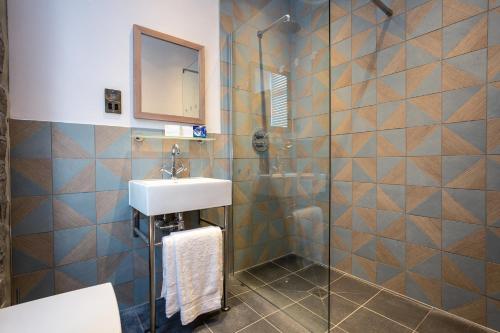 a bathroom with a sink and a shower at Eagle and Child, Ramsbottom in Bury