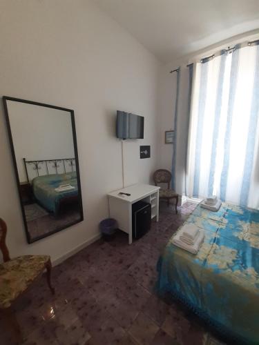 Postel nebo postele na pokoji v ubytování B&B Domus Morfeo