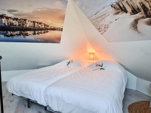 Säng eller sängar i ett rum på Vakantiewoning De kleine Vos MB02