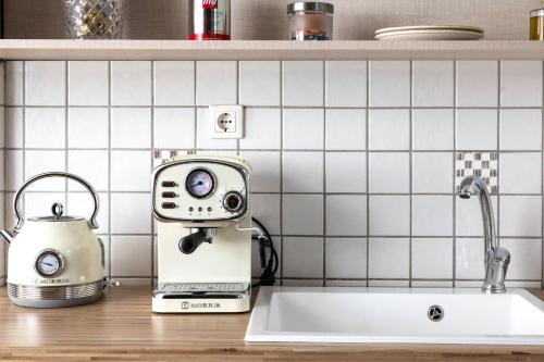 a kitchen counter with a toaster and a toaster at Arsas Suites in Nikiti