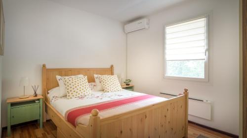 Кровать или кровати в номере Vila Camelia