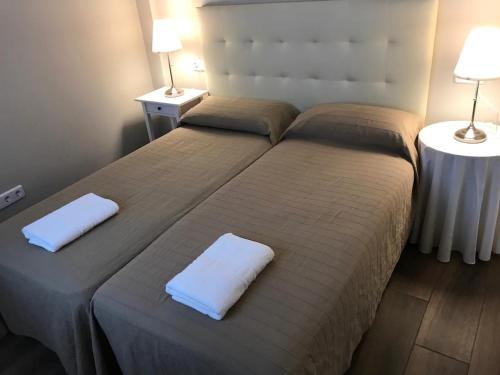 Cama o camas de una habitación en Maravilloso Piso en el Centro_WIFI_Parking_8People