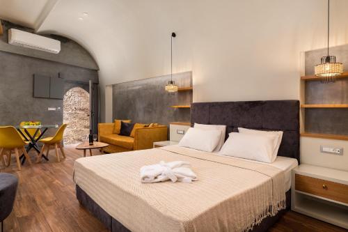Posteľ alebo postele v izbe v ubytovaní Zoe Suites