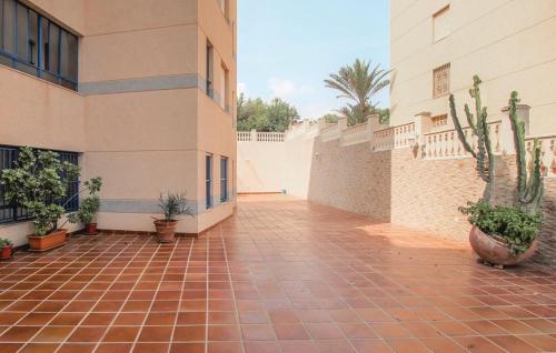 a courtyard of a building with potted plants at Apartamento Argentina by Rental Olé in El Moncayo