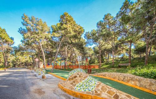 a playground in a park with a roller coaster at Apartamento Argentina by Rental Olé in El Moncayo