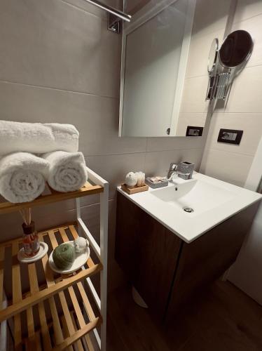 a bathroom with a sink and a mirror at Eden Room&Spa in Torre Maggiore