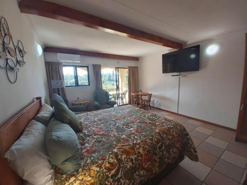 a bedroom with a large bed and a flat screen tv at Crayfish Inn no.8 in Ramsgate