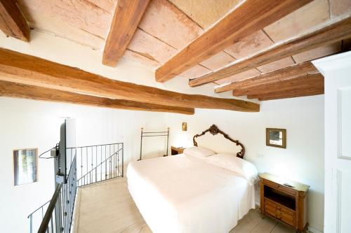 Un pat sau paturi într-o cameră la Le Stanze di Galileo