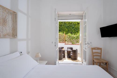Postel nebo postele na pokoji v ubytování Capri Town Apartments