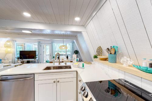a kitchen with a sink and a dishwasher at High Tide Hideaway in Dauphin Island