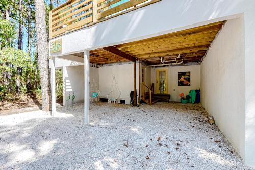 an empty garage with a wooden roof on top at High Tide Hideaway in Dauphin Island