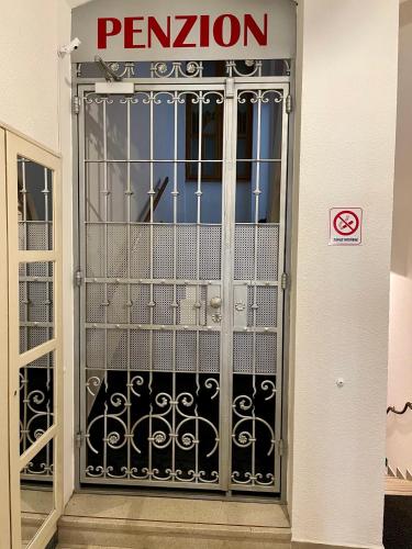 a metal gate with a no entry sign on it at Penzion u Vlčků in Cheb