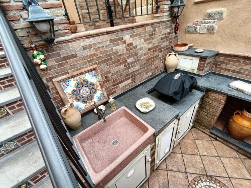 an overhead view of a kitchen with a sink at Villa Alecla - Sea Villa near Taormina in SantʼAlessio Siculo