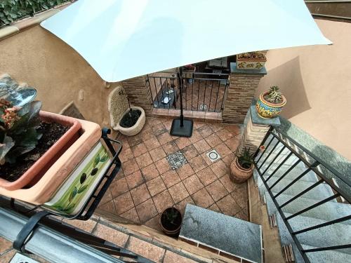 an overhead view of a patio with a plant at Villa Alecla - Sea Villa near Taormina in SantʼAlessio Siculo