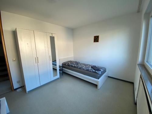 Кровать или кровати в номере Modernes Haus mit Garten & Balkon - Gratis WLAN - perfekt für Arbeiter