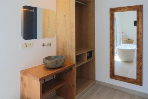 a bathroom with a sink, mirror, and cabinet at Play Hotel Ibiza in Ibiza Town
